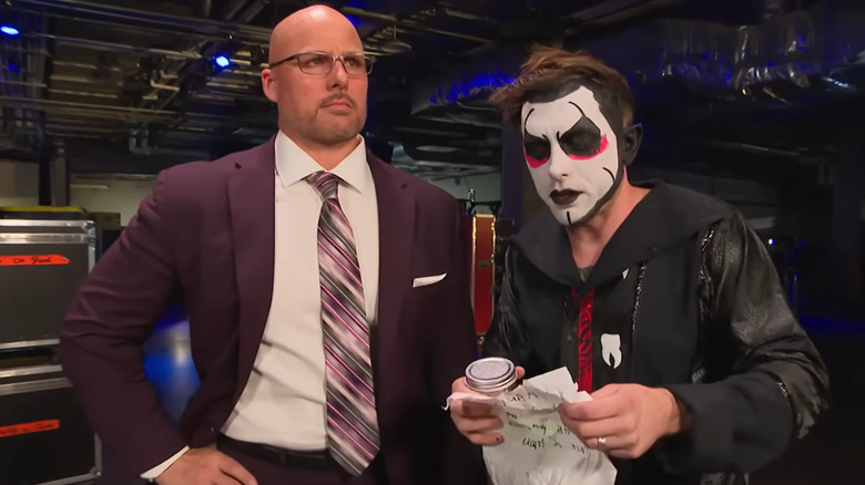 Danhausen standing next to Adam Pearce