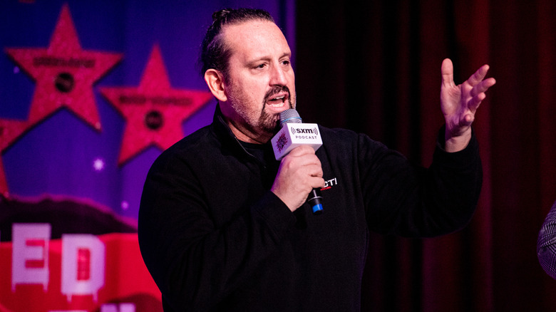 Tommy Dreamer talking into microphone