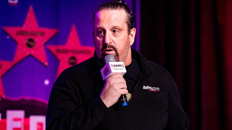 Tommy Dreamer talking into microphone