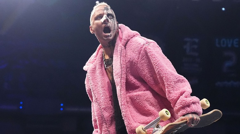 Darby Allin holding a skateboard