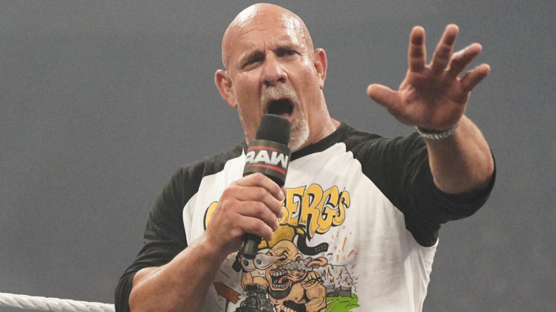 Goldberg holding a microphone