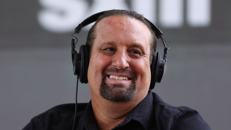 Tommy Dreamer smiling while wearing a headset