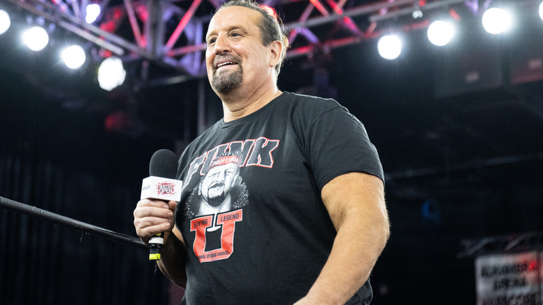 Tommy Dreamer with a microphone