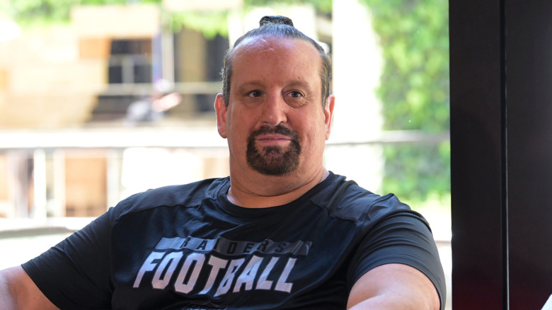 Tommy Dreamer is seated