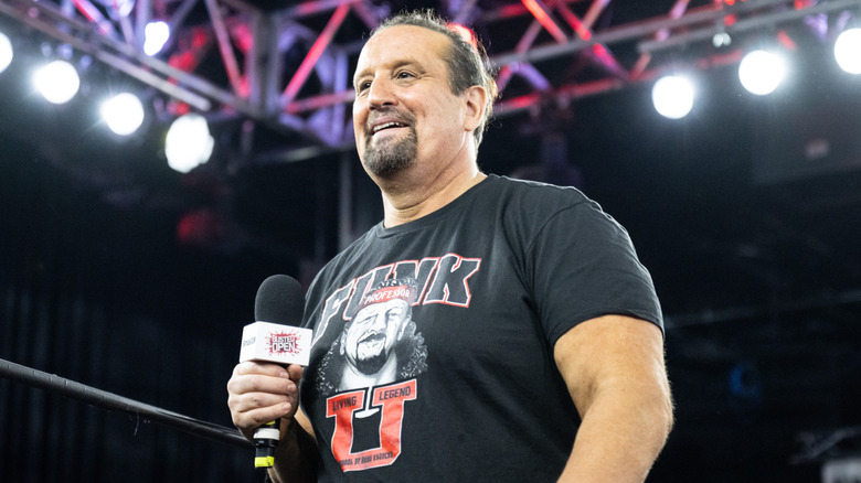 Tommy Dreamer smiles on waiting for a question from the audience during a live 