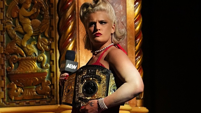 Toni Storm poses with her AEW Women's World Championship.