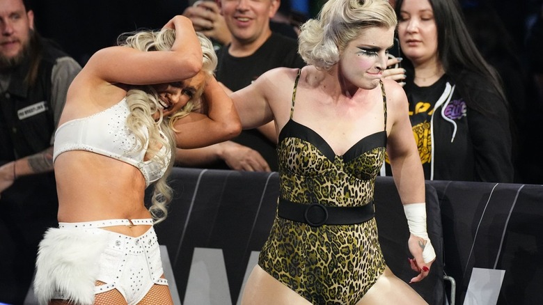 Toni Storm grabs Mariah May by the hair and pulls her to the ring during their Hollywood Ending match at AEW Revolution.