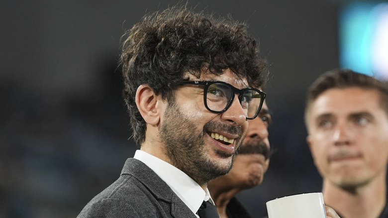Tony Khan beaming with delight
