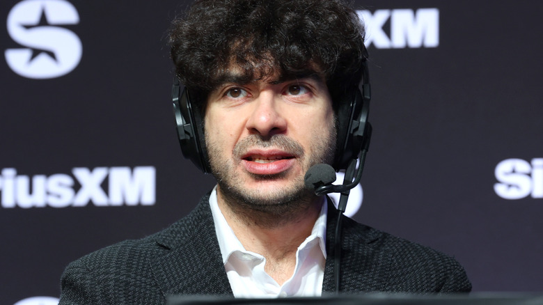 Tony Khan is wearing a headset