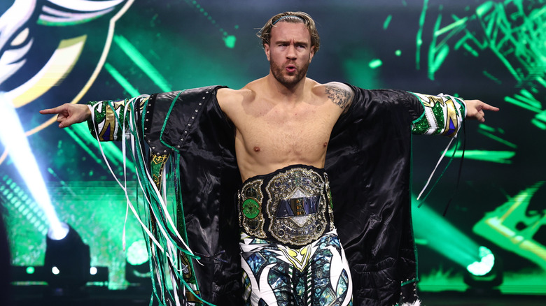 AEW World Champion Will Ospreay poses on the stage, title around his waist, before a match on the September 23, 2026 edition of 