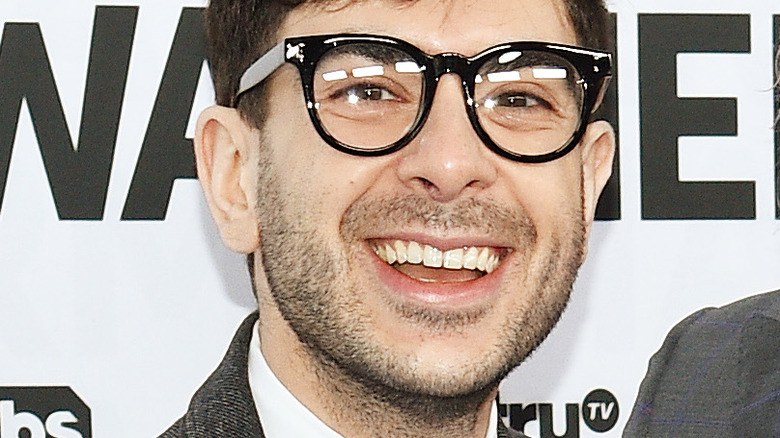 Tony Khan with glasses smiling