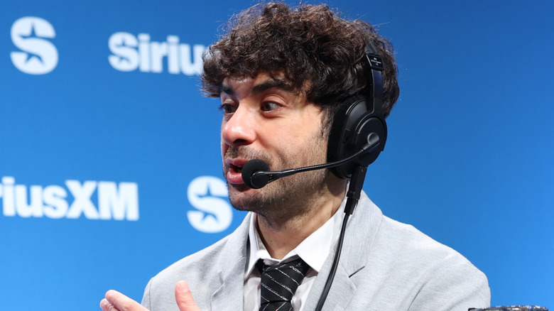 Tony Khan speaking at a SiriusXM event