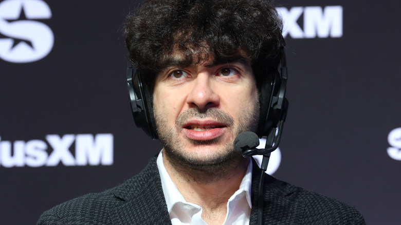 Tony Khan is wearing a headset