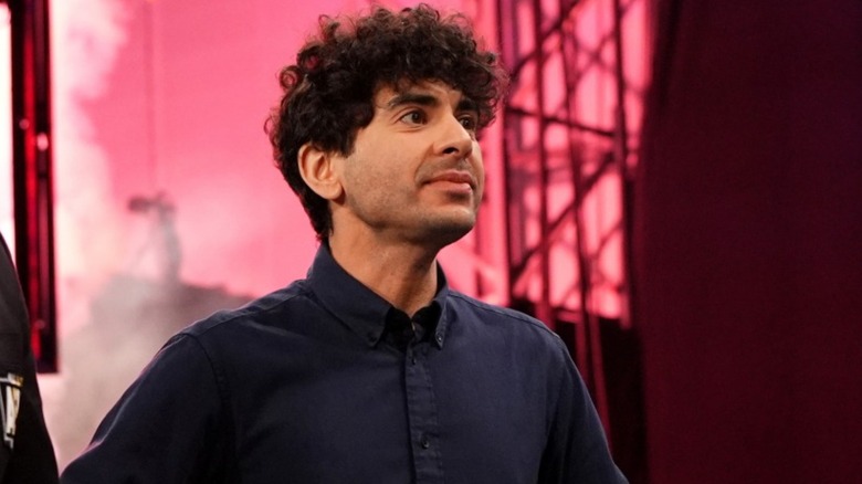 Tony Khan stands in the ring waiting