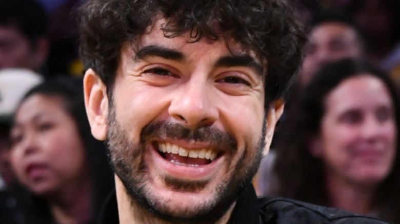 tony khan sitting courtside