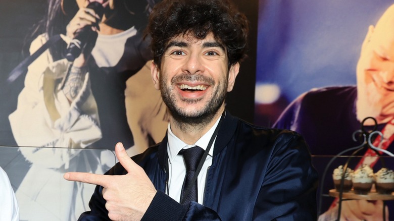 Tony Khan pointing with his finger guns