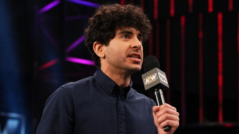 Tony Khan talking in an AEW ring