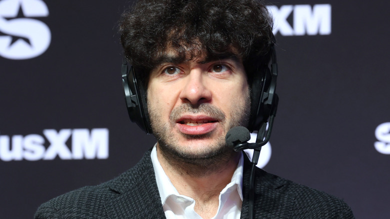 Tony Khan wearing a headset