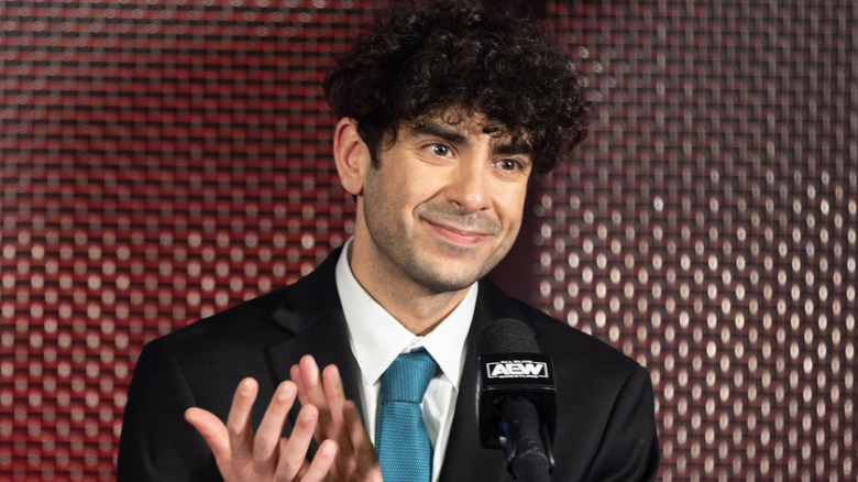 Tony Khan applauded during an AEW press conference