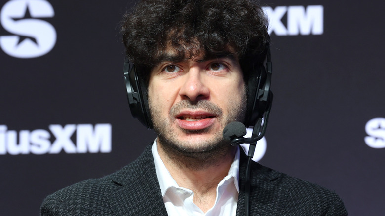 Tony Khan is wearing a headset