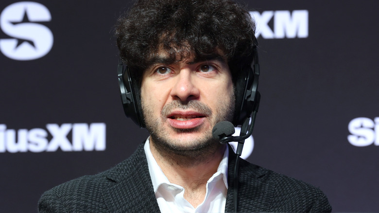 Tony Khan wearing a headset