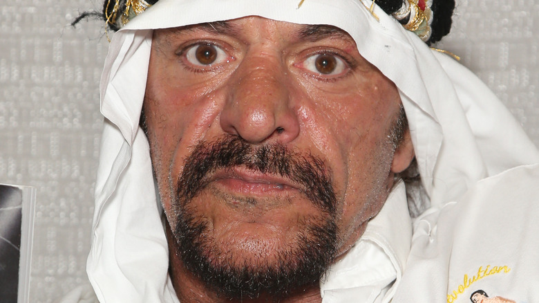 Sabu posing for a photo