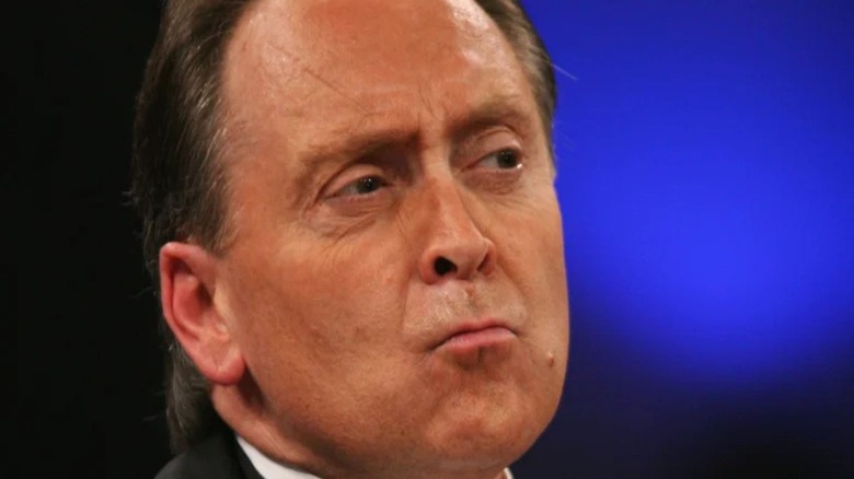 TNA commentator Mike Tenay makes a face as he looks toward someone in the ring during an episode of TNA programming.
