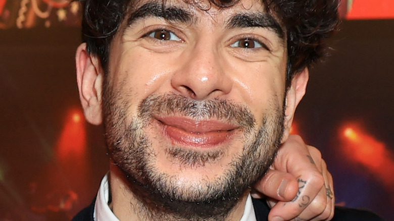 Tony Khan Smiles At A Promotional Event