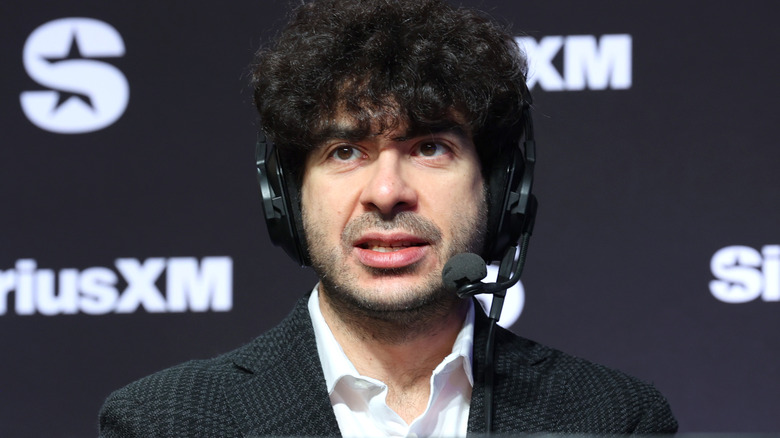 Tony Khan is wearing a headset