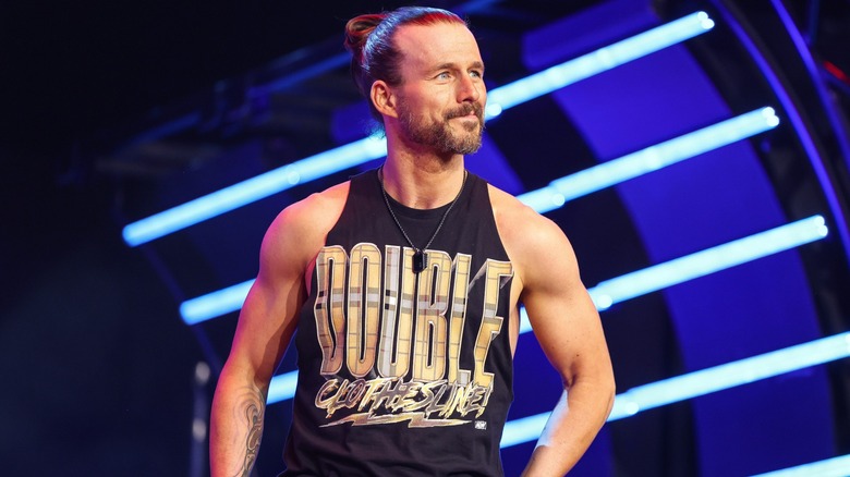 Adam Cole smirks on his way to the ring