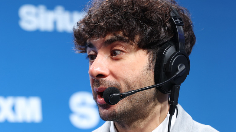 Tony Khan wearing a headset