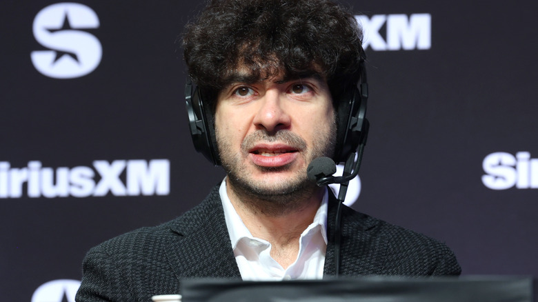 Tony Khan wearing a headset