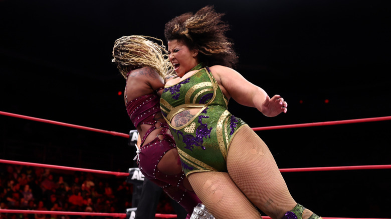 Willow Nightingale performing a wrestling move in the ring