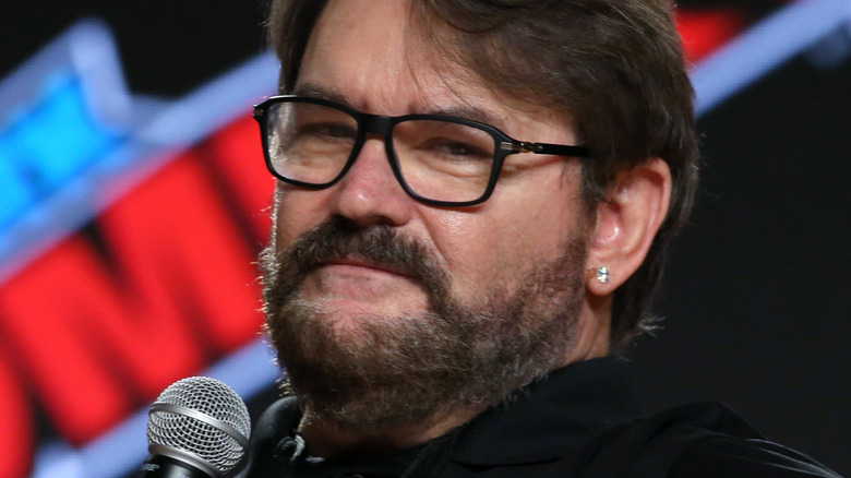 Tony Schiavone holds mic