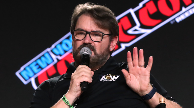 Tony Schiavone puts his hand up