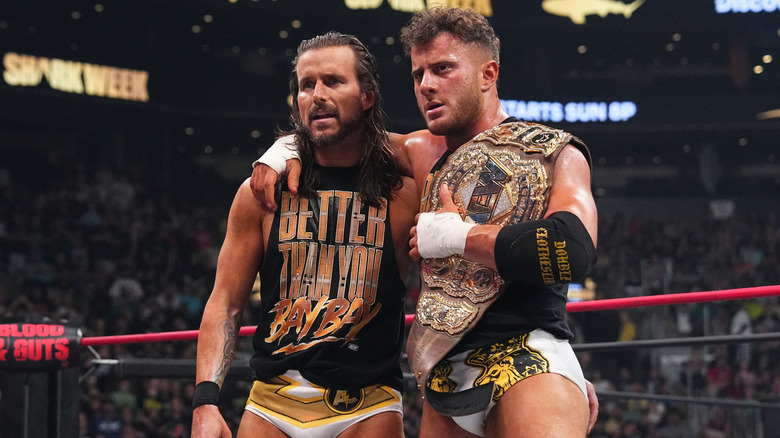 Adam Cole and MJF stand together as a team