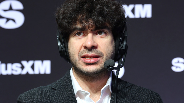 Tony Khan wearing a headset