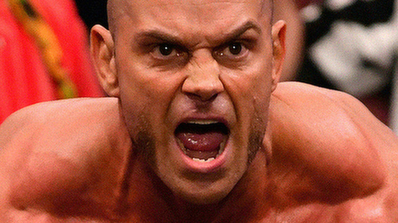 Brian Cage posing in the ring 