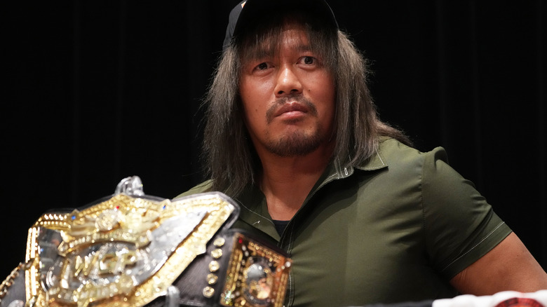 Tetsuya Naito with the IWGP World Title