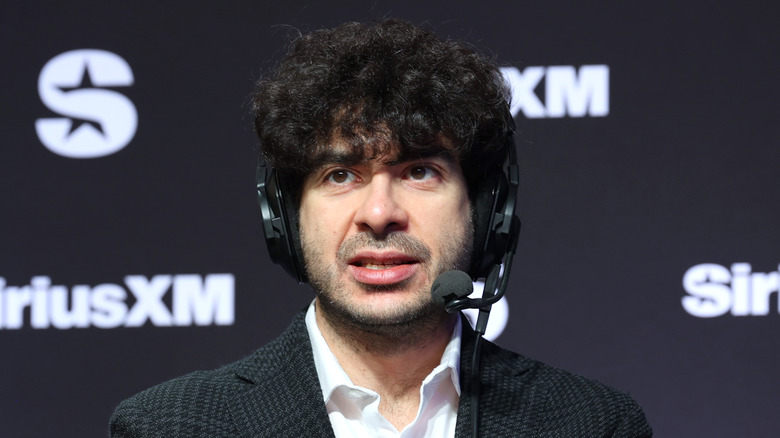 Tony Khan wearing the headset