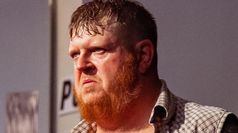 Trevor Murdoch stares at his opponent in the ring