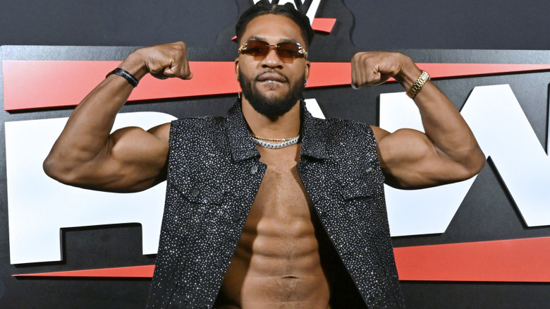 Trick Williams flexing his arms