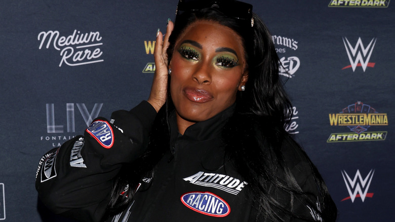 Lash Legend wearing sunglasses on her head