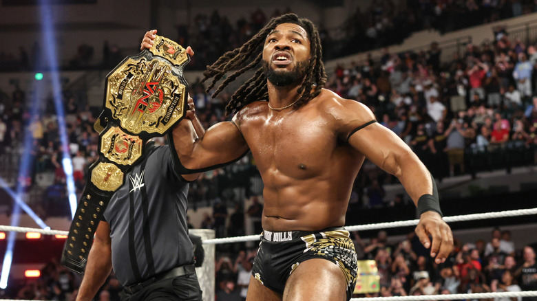Trick Williams celebrates winning the TNA World Heavyweight Championship during NXT Battleground at Yuengling Center on May 25, 2025 in Tampa, Florida.