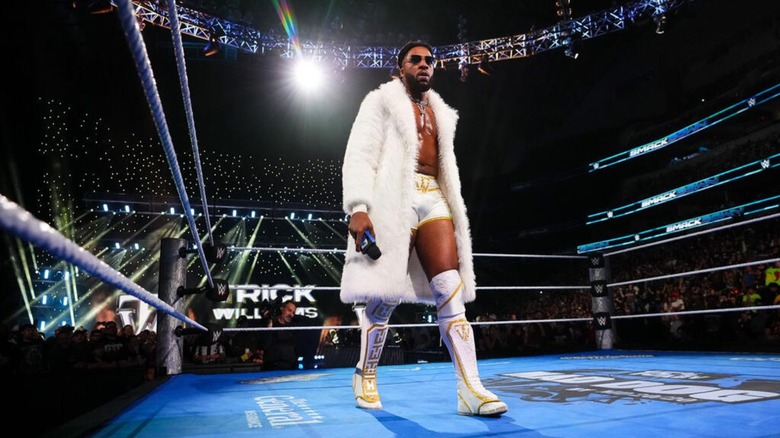 Trick Williams stands in the ring, microphone in hand, to cut a promo before a match on 