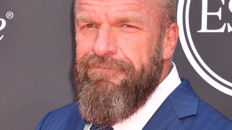 Triple H grinning