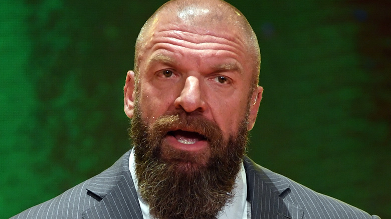 Triple H wearing a suit