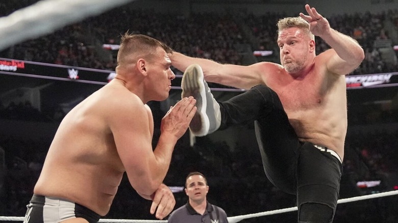 Pat McAfee plants a boot into the face of GUNTHER during their match at WWE Backlash 2025.