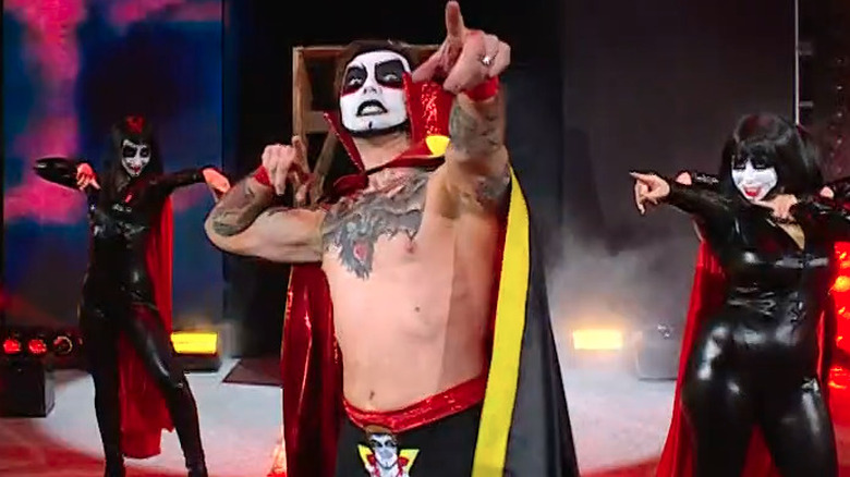 Danhausen poses during his entrance at WWE Elimination Chamber