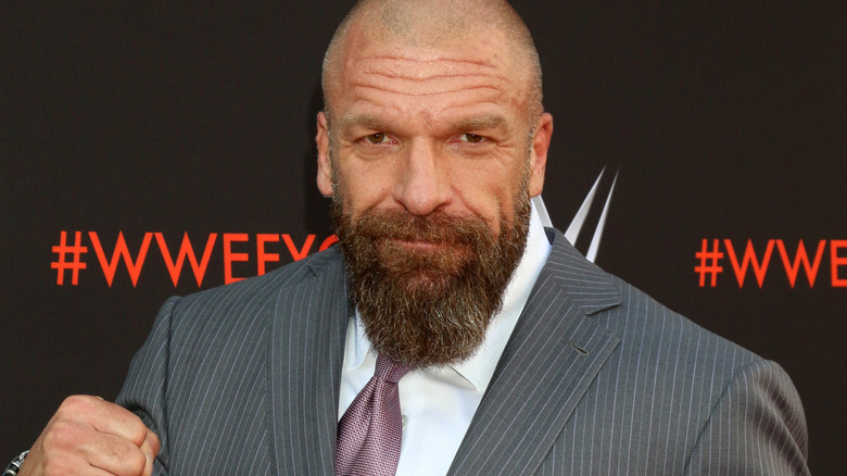 Triple H smirking